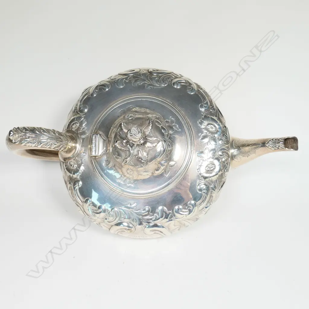 A Victorian silver teapot, with ornate floral repousse decoration, Image 1++