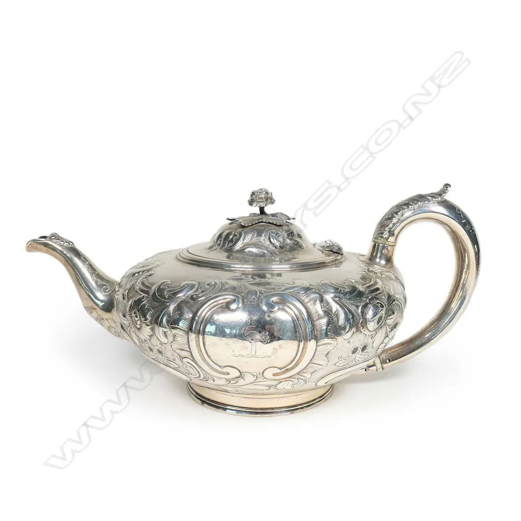 A Victorian silver teapot, with ornate floral repousse decoration, Image 1++
