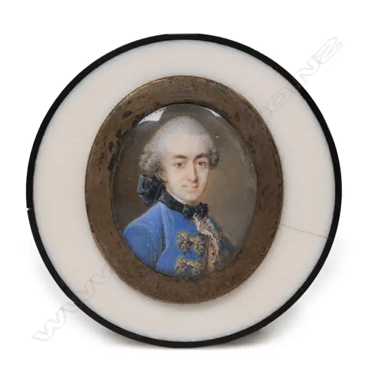 A circular ivory table snuff box set with an oval miniature portrait on ivory,