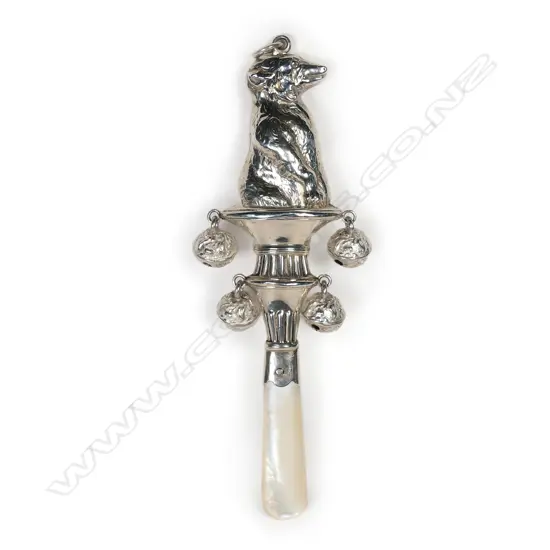 An early 1900s silver and mother of pearl baby rattle,
