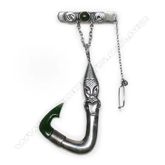 A Peter Mintern silver hei matau (fishhook) with greenstone carved barb