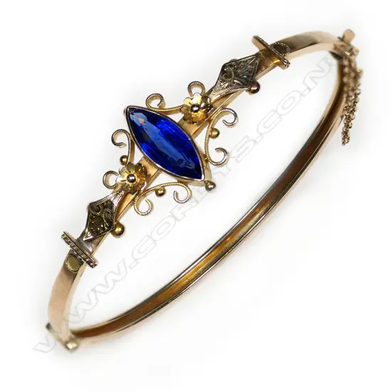 An Edwardian 9ct gold hinged snap bangle,