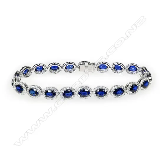 A 14ct white gold, sapphire and diamond halo tennis bracelet,