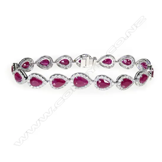 A 14ct white gold, Burmese ruby and diamond halo tennis bracelet,