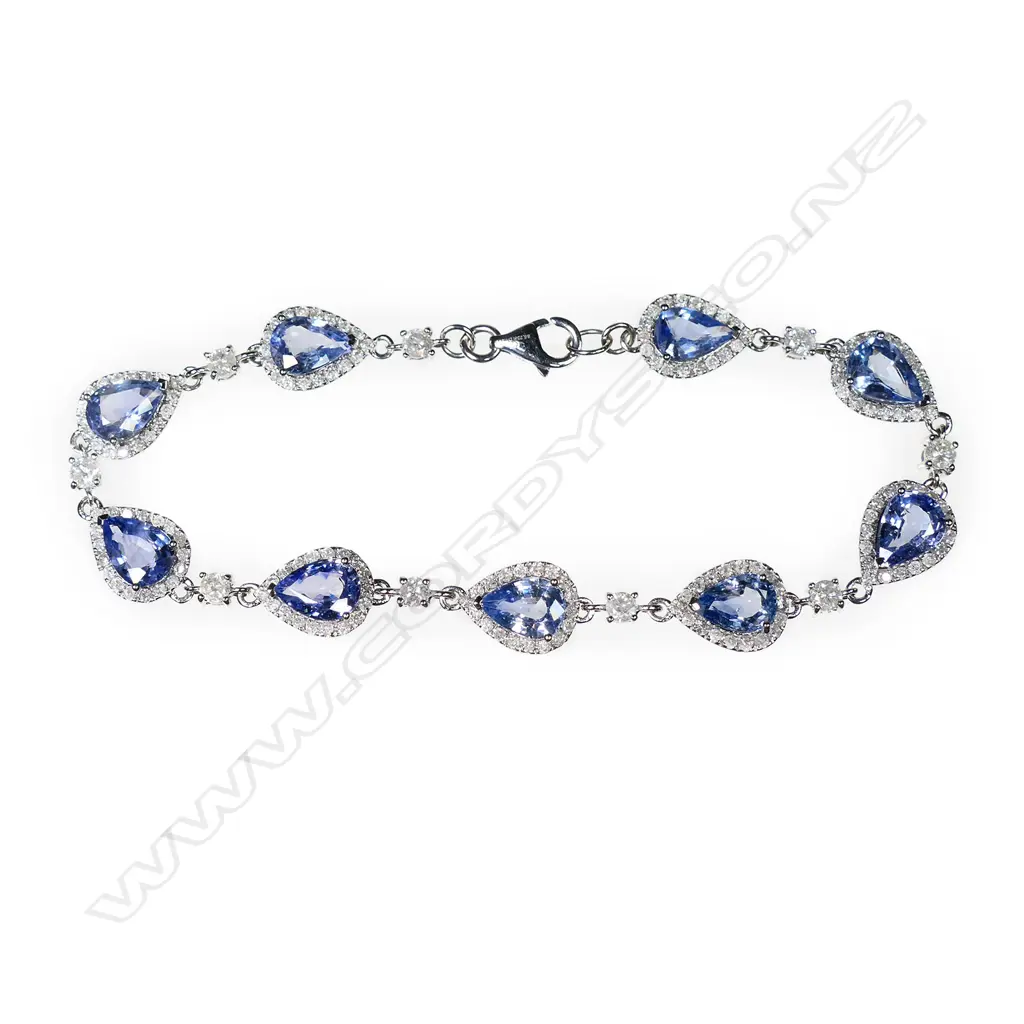 A 14ct white gold, Ceylonese sapphire and diamond halo bracelet, Image 1++