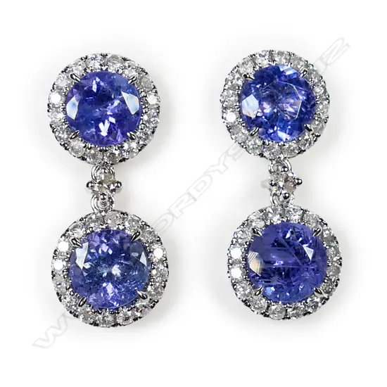 A pair of 14ct white gold, tanzanite and diamond double drop earrings,