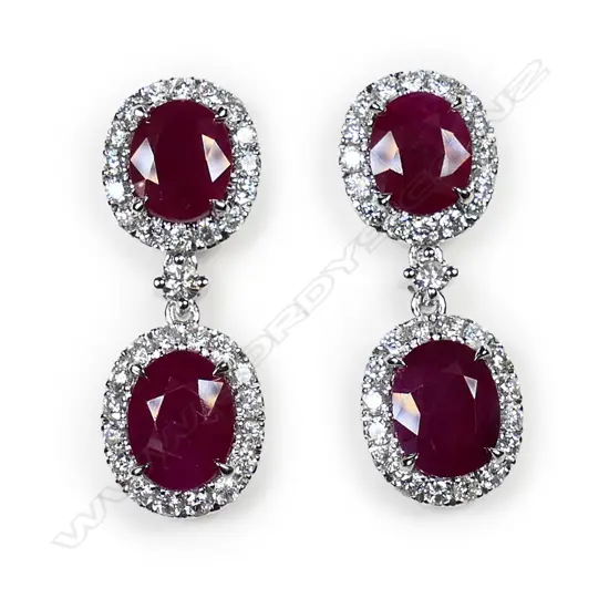 A pair of 14ct white gold, ruby and diamond drop earrings,