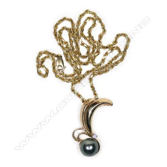A 14k yellow gold pearl and diamond pendant on chain,