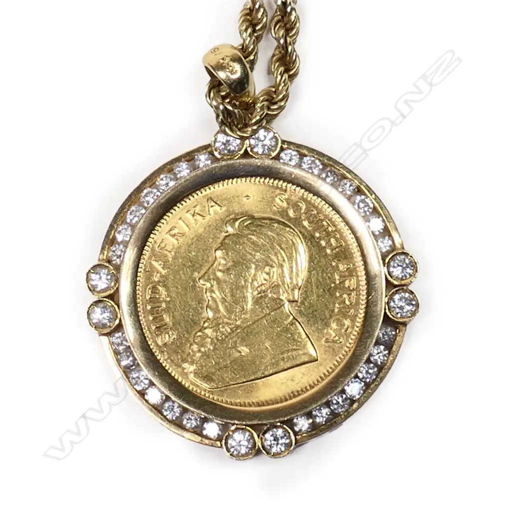 A ¼ Krugerrand gold coin in diamond set frame on chain, Image 1++