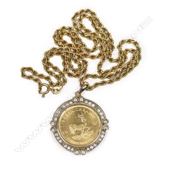 A ¼ Krugerrand gold coin in diamond set frame on chain,