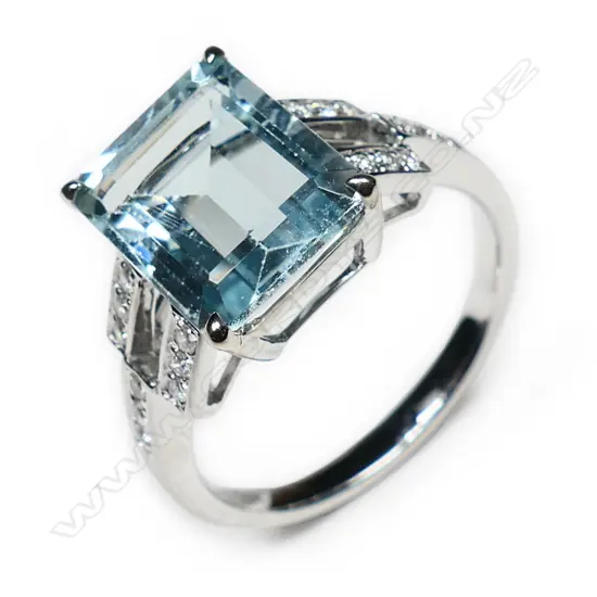 A 14k white gold aquamarine diamond and sapphire ring,