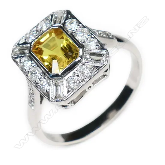 An 18ct white gold, yellow sapphire and diamond Art Deco style ring,
