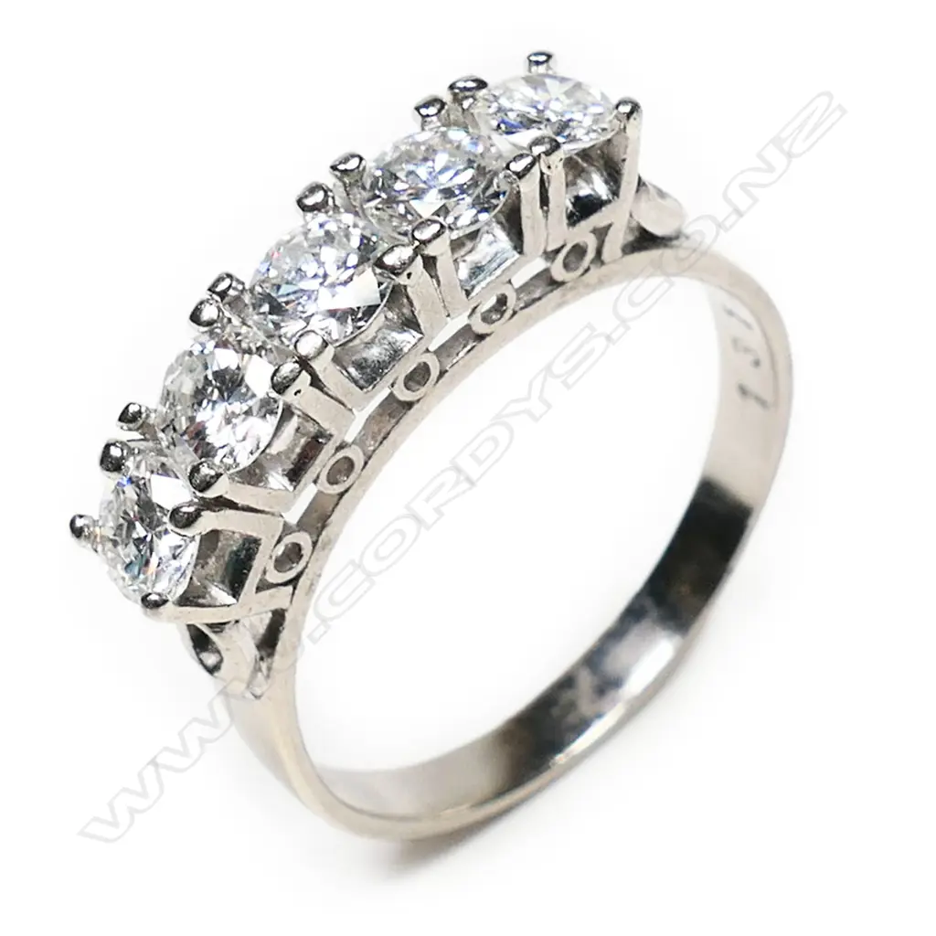 A 14ct white gold and five stone diamond bridge ring, Image 1++