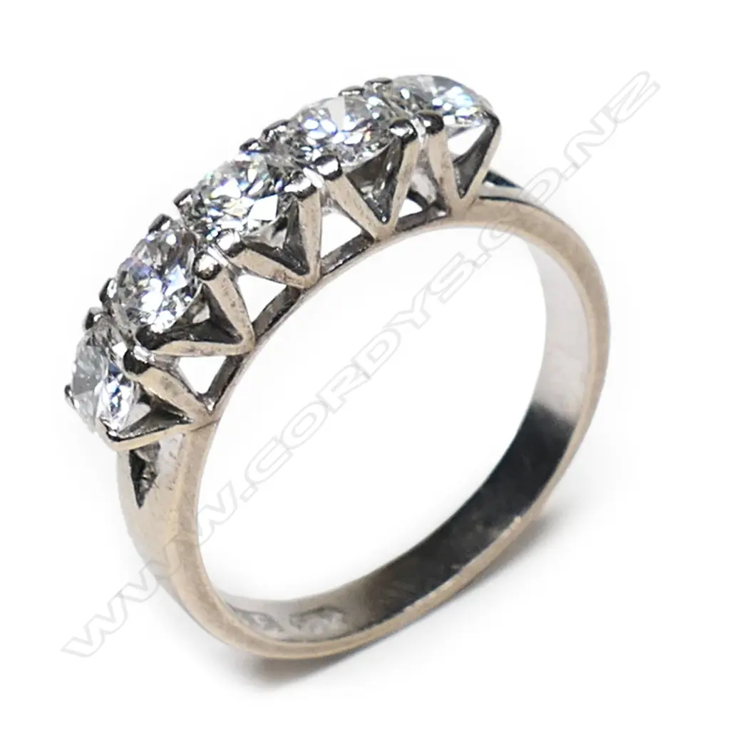 A 14ct white gold and five diamond bridge ring, Image 1++