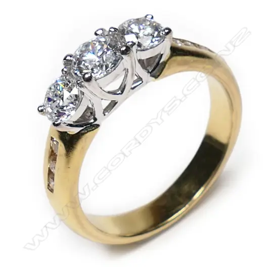 An 18ct gold and three stone diamond ring,