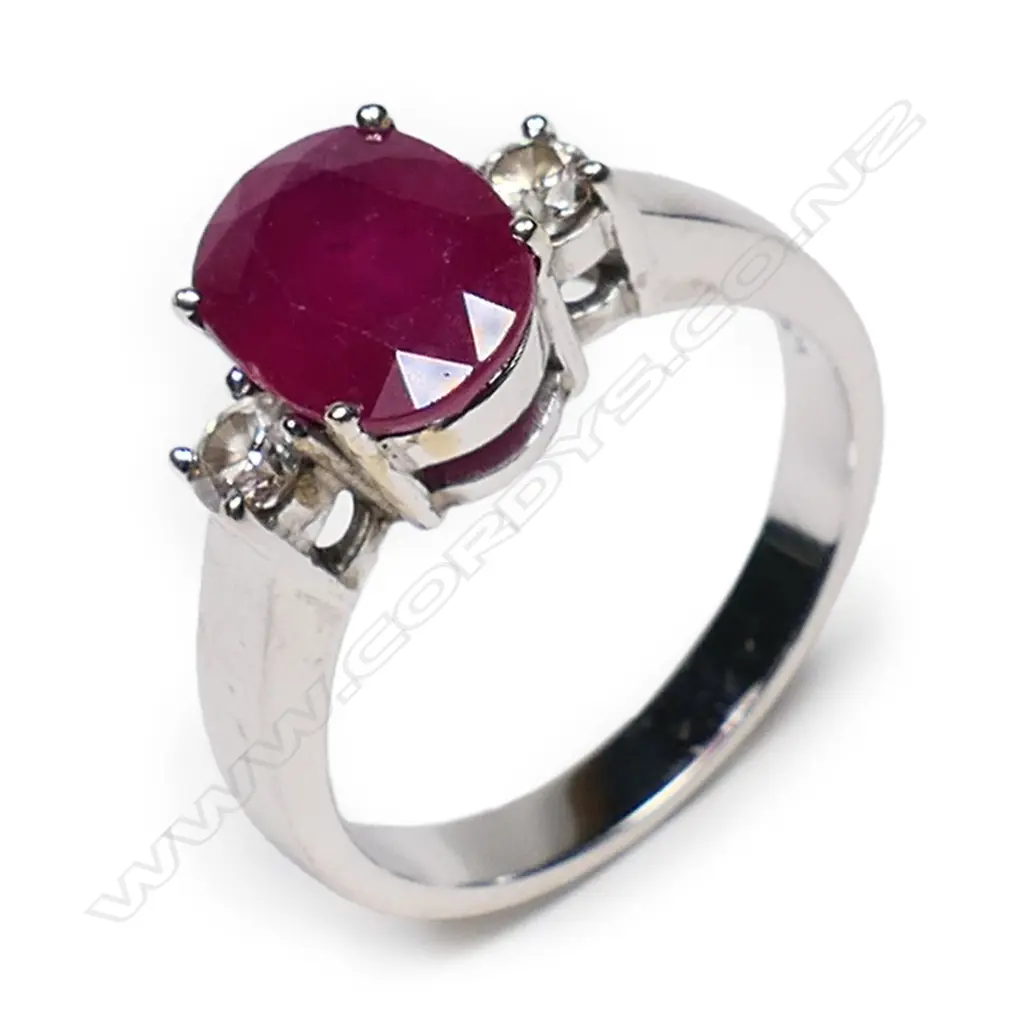 An 18ct white gold, ruby and diamond ring, Image 1++
