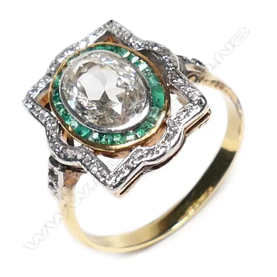 An Art Deco 18ct gold, platinum, diamond and emerald ring,
