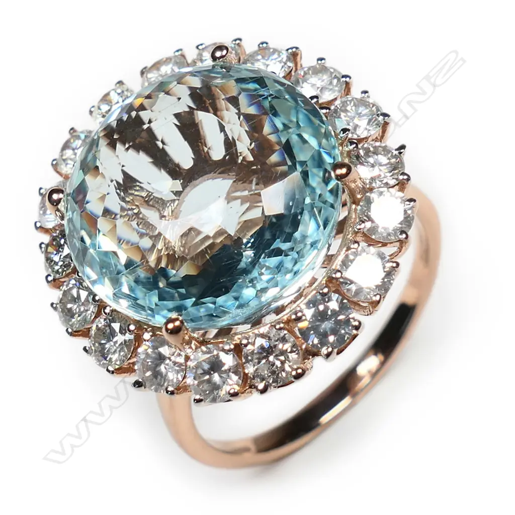 A 14ct white gold aquamarine and diamond halo ring, Image 1++