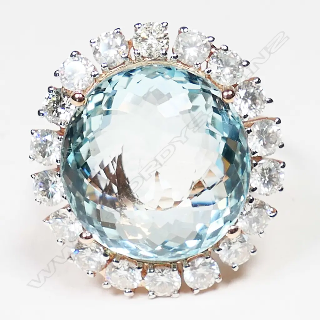 A 14ct white gold aquamarine and diamond halo ring, Image 1++