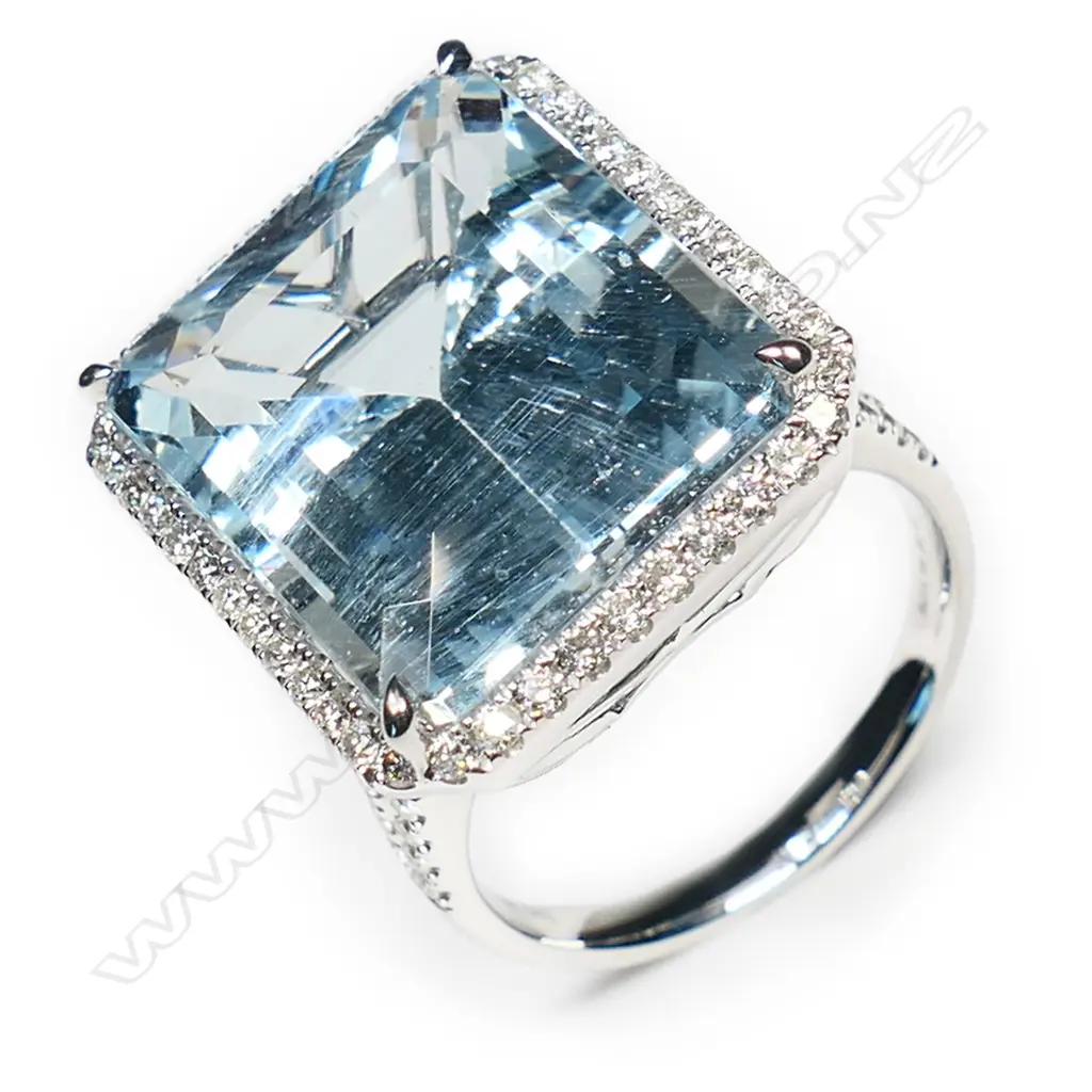 A 14ct white gold aquamarine and diamond halo ring, Image 1++