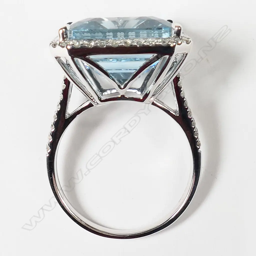 A 14ct white gold aquamarine and diamond halo ring, Image 1++