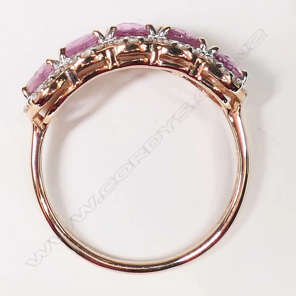 A 14ct rose gold, pink sapphire and diamond eternity ring, Image 1++