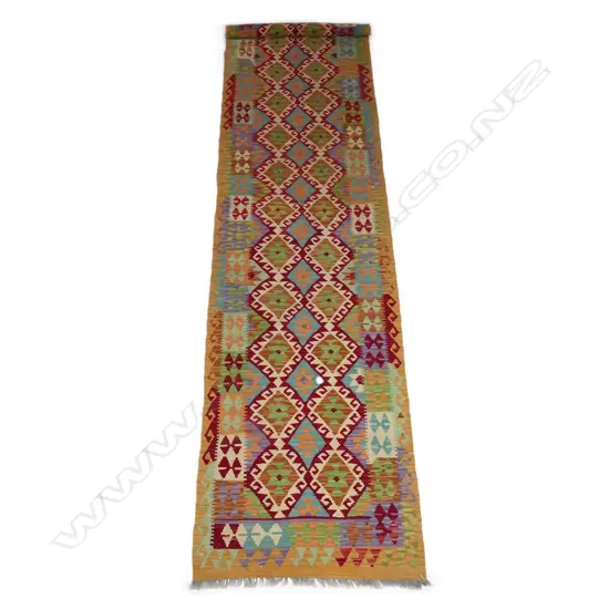 A hand-woven kilim runner,