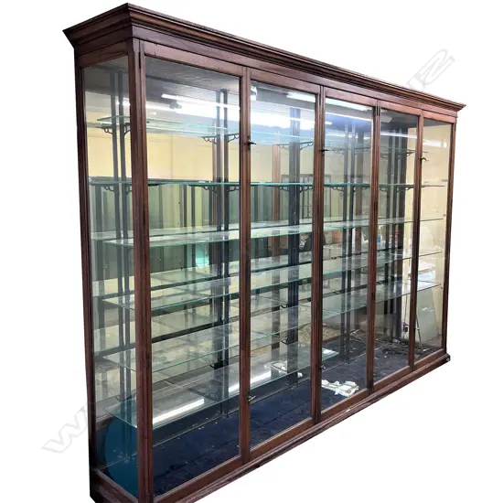 A large and impressive five door glazed shop display cabinet,