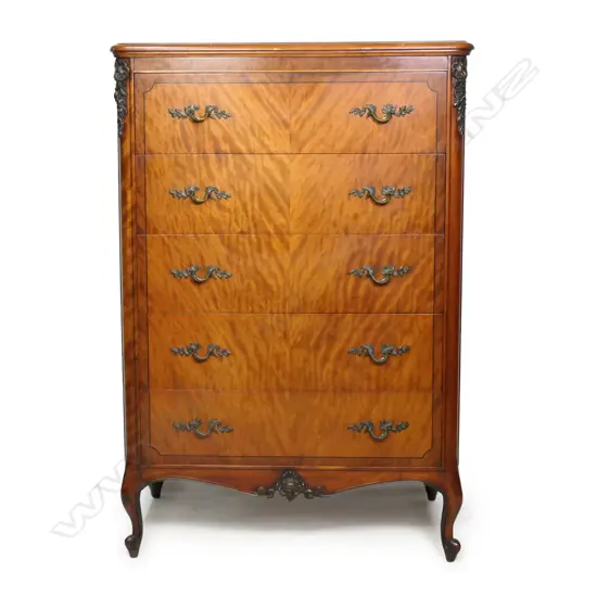 A 1950s French antique style five drawer chest,