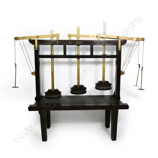 A vintage large wood and brass Dutch triple lever cheese press,