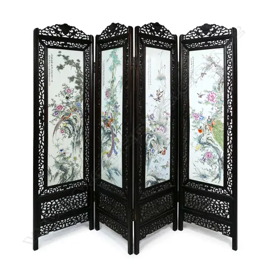 A Chinese hardwood and famille rose four-fold screen,