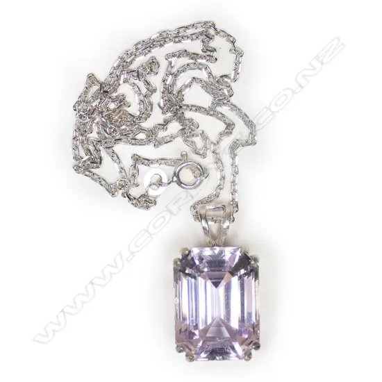 A large kunzite silver mounted pendant on chain,