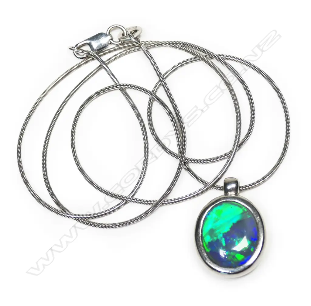 An 18ct white gold and black opal pendant, Image 1++