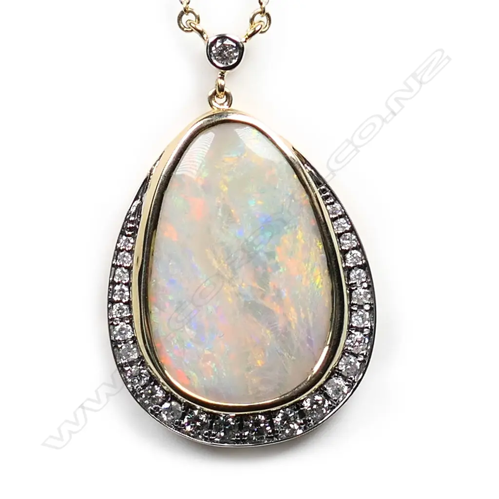 A 14ct gold, natural white opal and diamond pendant necklace, Image 1++
