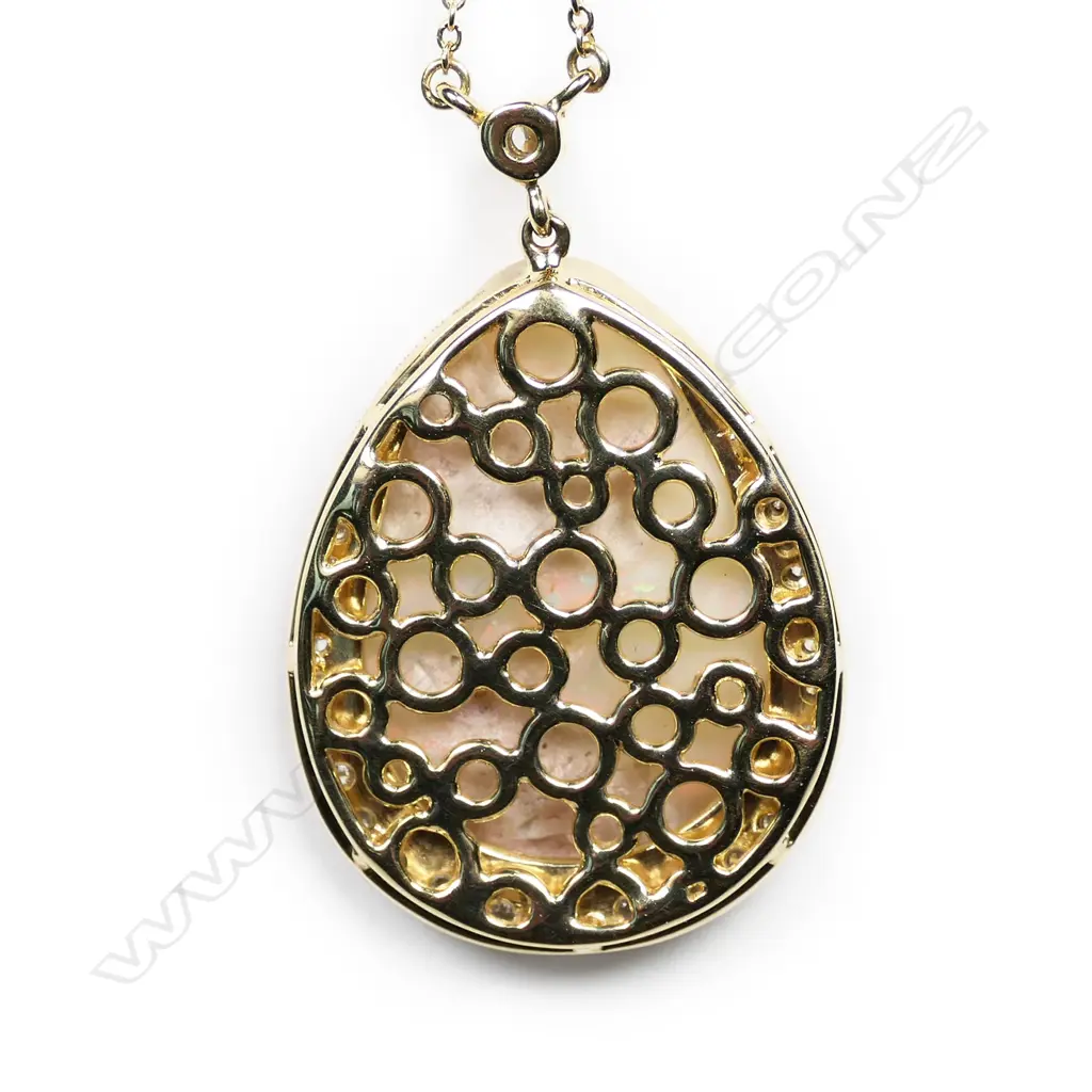 A 14ct gold, natural white opal and diamond pendant necklace, Image 1++