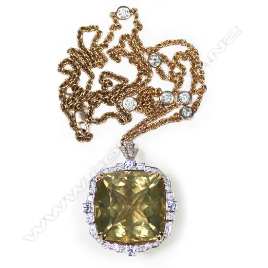 A 14ct rose gold, lemon quartz and diamond halo pendant necklace,
