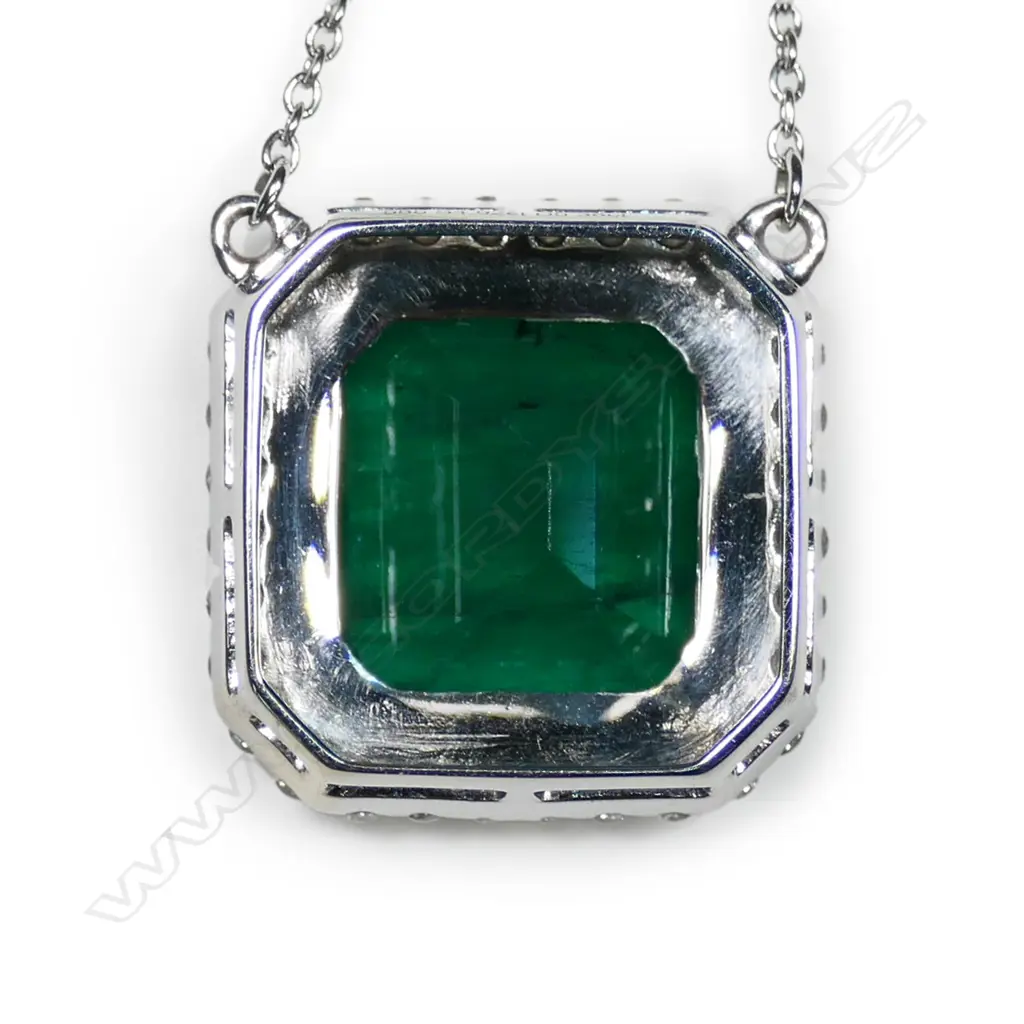 A 14ct white gold, emerald and diamond halo pendant necklace, Image 1++