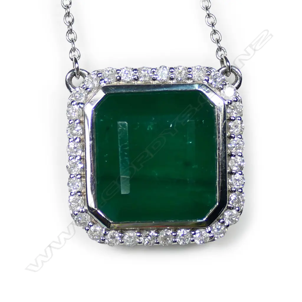 A 14ct white gold, emerald and diamond halo pendant necklace, Image 1++