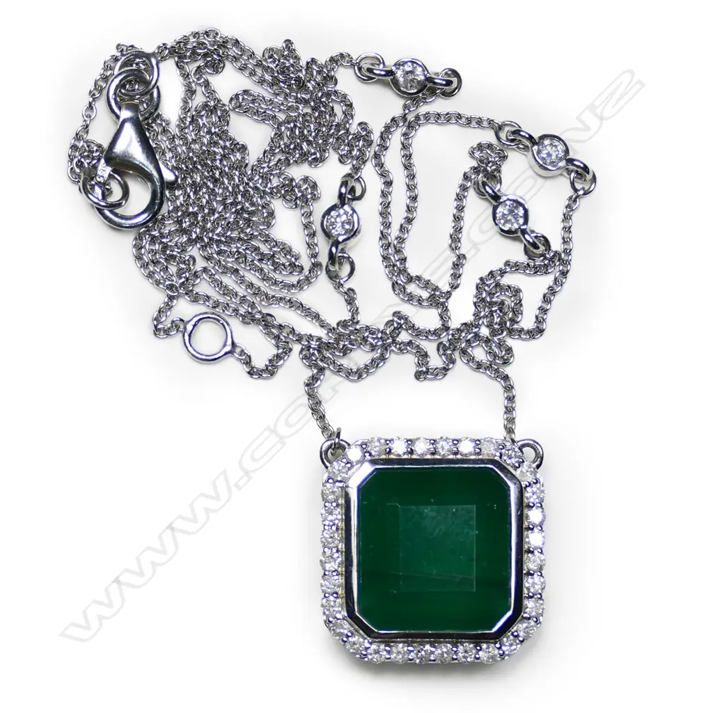 A 14ct white gold, emerald and diamond halo pendant necklace, Image 1++