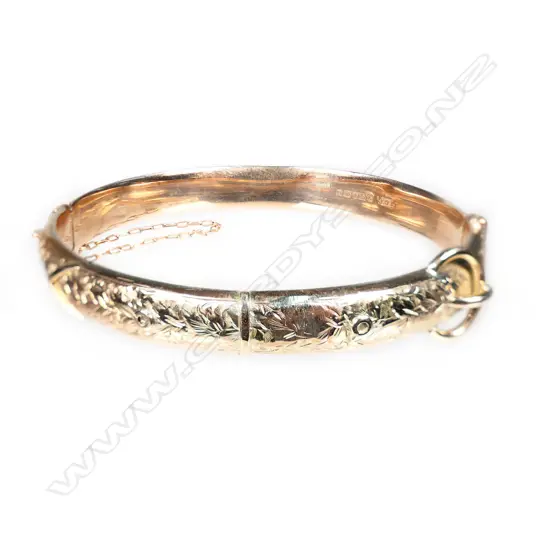 A 9ct rose gold half hinged bangle,