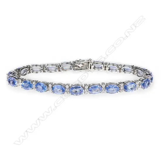 A 14ct white gold, sapphire and diamond line bracelet,