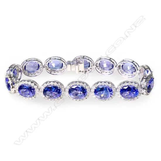 A 14ct white gold, tanzanite and diamond halo bracelet,