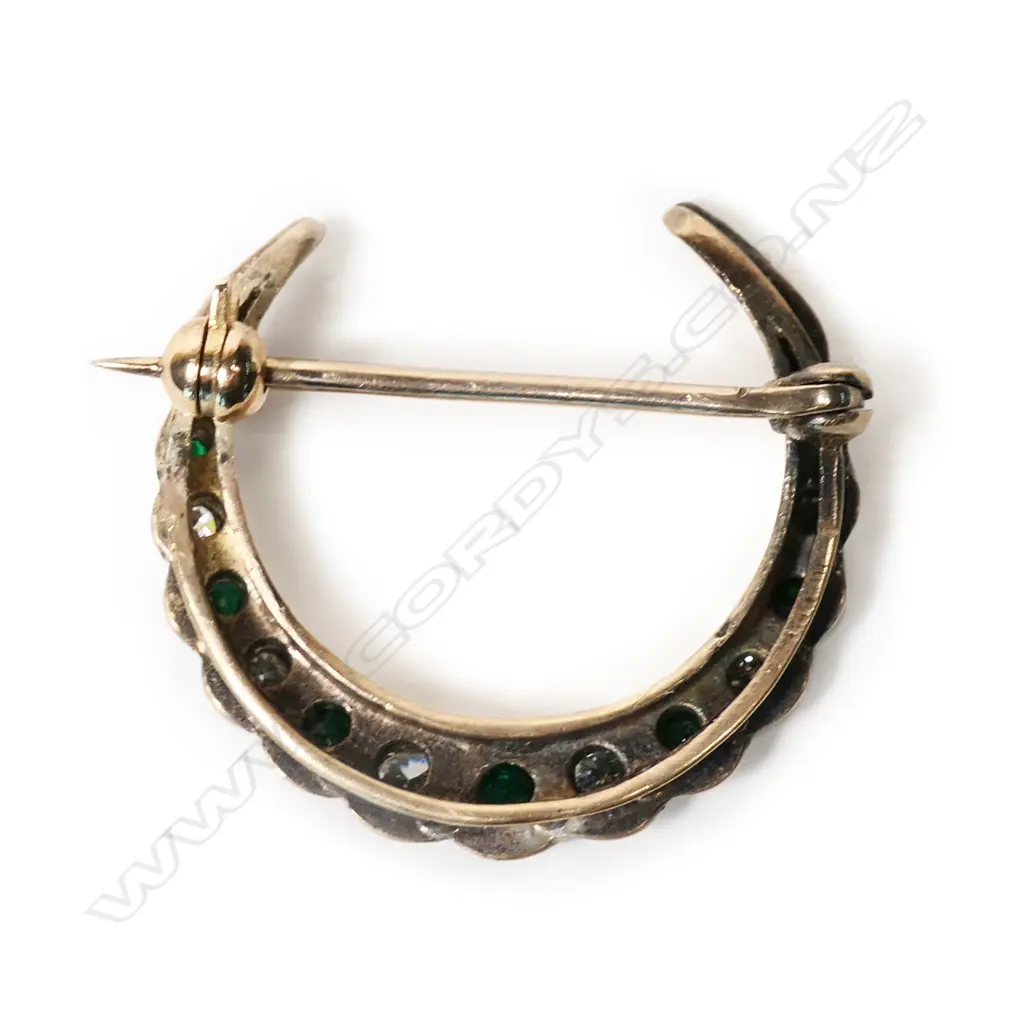 A 1920's 9ct gold, emerald and diamond crescent brooch, Image 1++