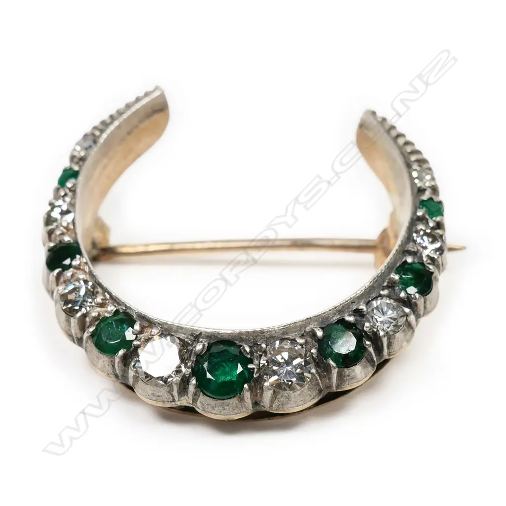 A 1920's 9ct gold, emerald and diamond crescent brooch, Image 1++