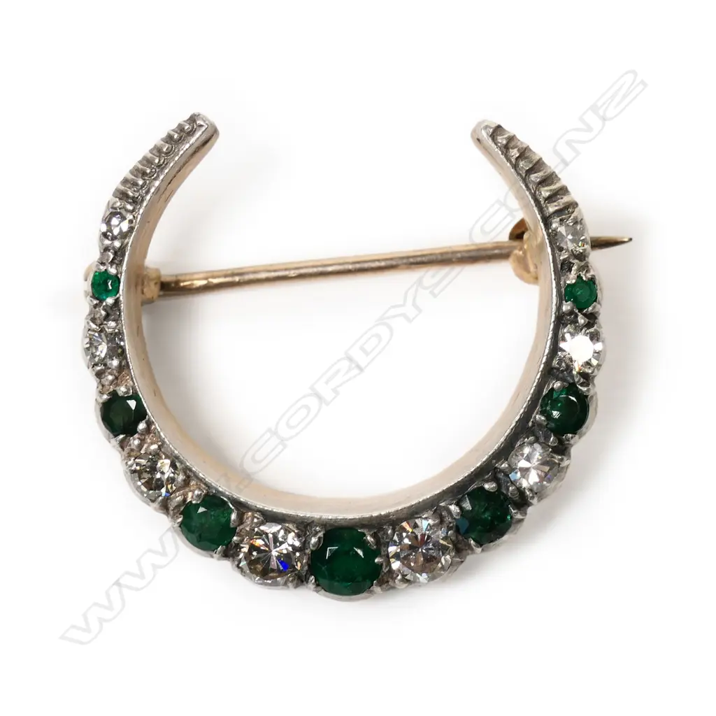 A 1920's 9ct gold, emerald and diamond crescent brooch, Image 1++