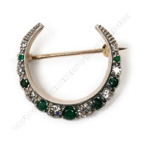 A 1920's 9ct gold, emerald and diamond crescent brooch,