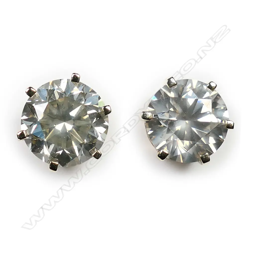 A pair of 14ct gold and diamond stud earrings, Image 1++