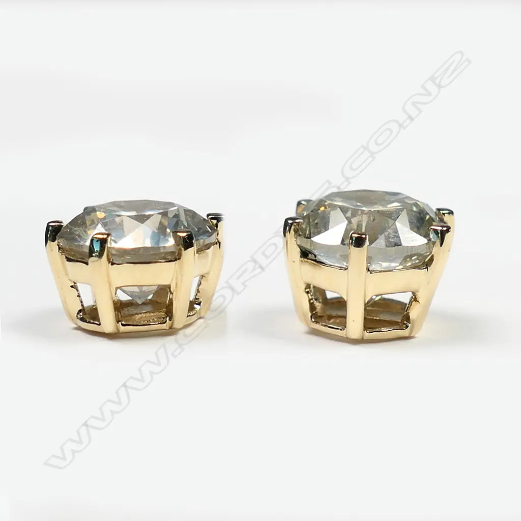 A pair of 14ct gold and diamond stud earrings, Image 1++