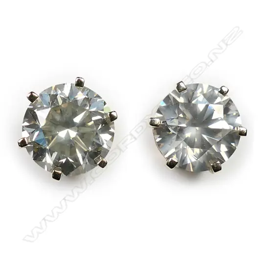 A pair of 14ct gold and diamond stud earrings,