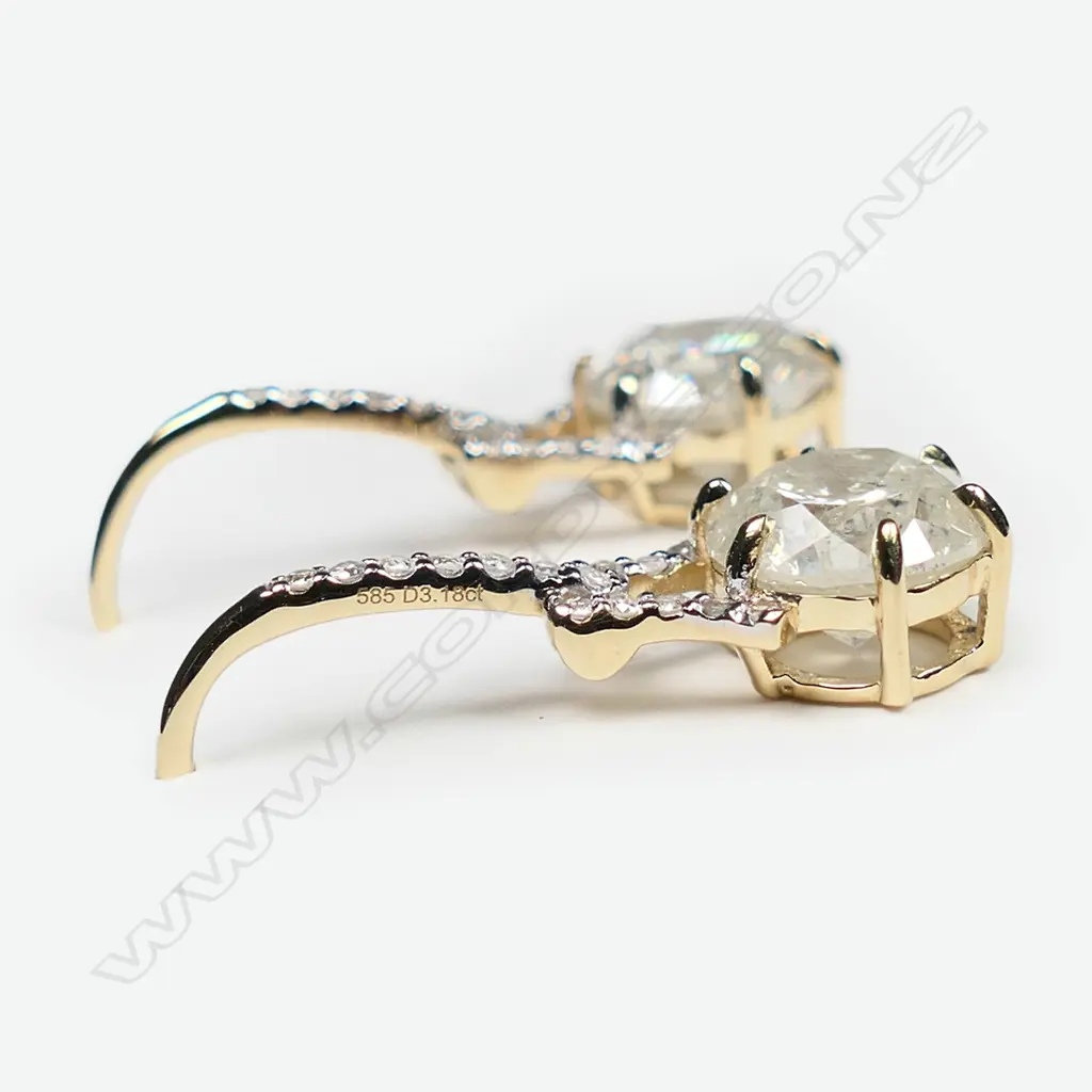A pair of 14ct gold and diamond drop earrings, Image 1++